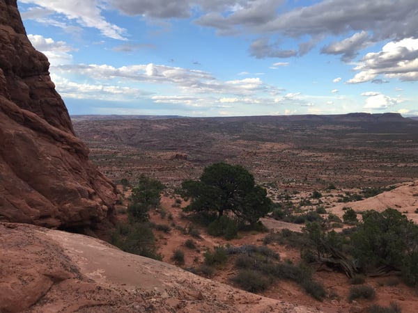 Expansive desert landscape with red rock formations viewed from a high elevation overlook near Moab, Utah. — Moab, Arches & Canyonlands