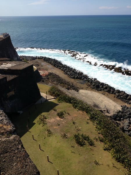 Fort San Felipe del Morro's coastal fortification and rocky shoreline with crashing waves viewed from the fortress… — Faro del Castillo San Felipe del Morro, San Juan