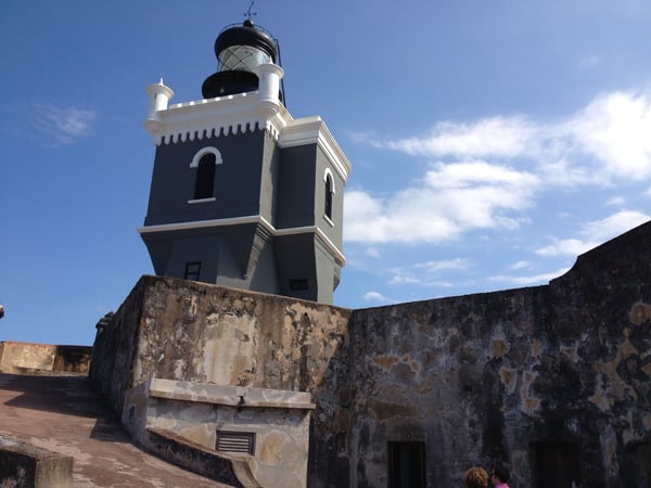 Faro del Castillo San Felipe del Morro lighthouse tower with black and white striped design rising above weathered… — Faro del Castillo San Felipe del Morro, San Juan