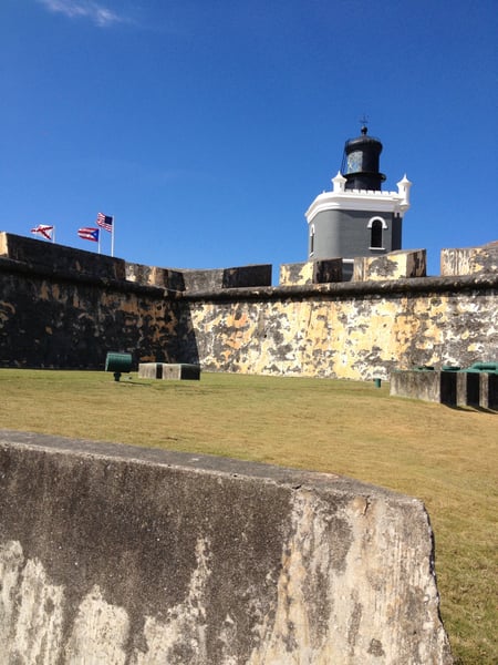 Lighthouse tower at Castillo San Felipe del Morro viewed from the fort's courtyard with weathered stone walls and… — Faro del Castillo San Felipe del Morro, San Juan