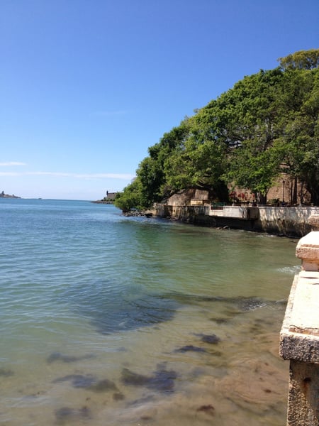 Turquoise waters and historic stone fortifications along the waterfront at Fuente Raíces in San Juan Antiguo, Puerto… — Fuente Raíces, San Juan