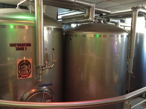 Maturation Tank 1 at a brewery facility in San Juan Antiguo, showing large stainless steel fermentation vessels with… — Viejo San Juan, San Juan