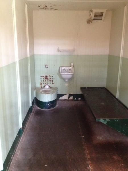 Interior of a prison cell at Alcatraz Island's Main Cell House, showing bunk, sink, and toilet fixtures. — Alcatraz Island, San Francisco