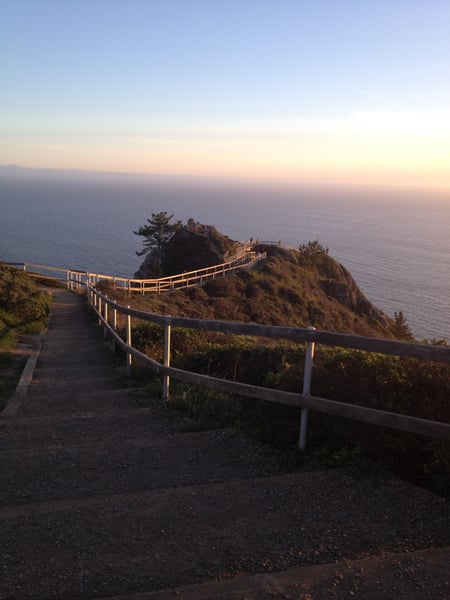 Wooden boardwalk leading to a coastal overlook at Muir Beach with ocean views during golden hour. — Muir Beach Overlook, San Francisco