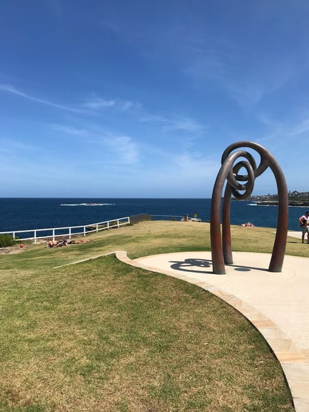 Modern sculptural art installation at Bali Memorial overlooking the ocean and coastal parkland in Randwick, Sydney.