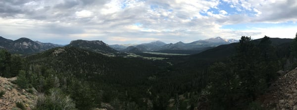 Expansive mountain valley with forested slopes and distant peaks viewed from Many Parks Curve Overlook in Estes Park… — Many Parks Curve Overlook, Rocky Mountain National Park