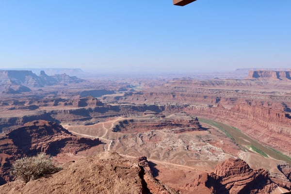 Expansive desert landscape with meandering river and layered red rock formations viewed from Dead Horse Point State… — Moab, Arches & Canyonlands