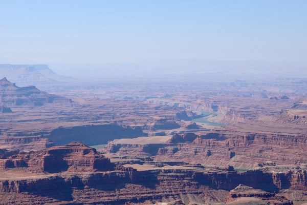 Aerial view of the Canyonlands region near Moab showing expansive desert plateau with layered buttes, mesas, and a… — Dead Horse Point State Park, Moab, Arches & Canyonlands