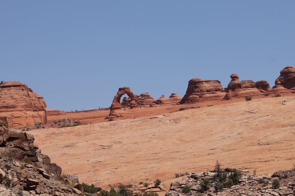 Delicate Arch and surrounding red rock formations viewed from the Lower Delicate Arch Viewpoint in Moab, Utah. — Lower Delicate Arch Viewpoint, Moab, Arches & Canyonlands