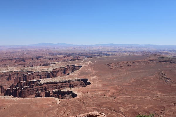 Vast desert landscape with red rock formations and winding river viewed from Grand View Point Overlook. — Grand View Point Overlook, Moab, Arches & Canyonlands