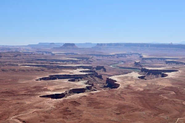 Aerial view of the Green River winding through canyon formations and mesas at Green River Overlook near Moab, Utah. — Moab, Arches & Canyonlands