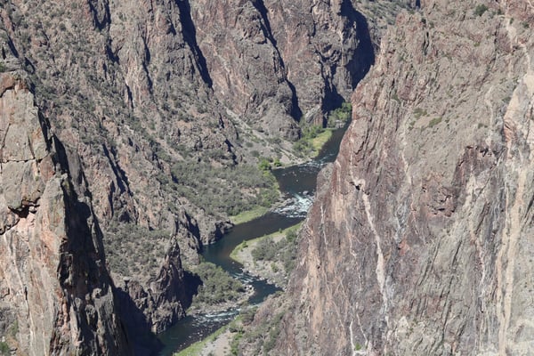 Deep canyon with river flowing through verdant valley, viewed from Painted Wall Trail in Crawford, Colorado. — Painted Wall View, Black Canyon of the Gunnison