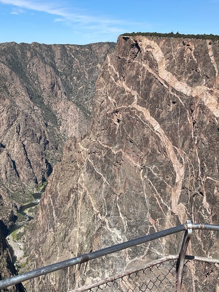 Painted Wall View in Montrose, Colorado shows steep canyon walls with a river flowing through the gorge below, viewed… — Painted Wall View, Black Canyon of the Gunnison