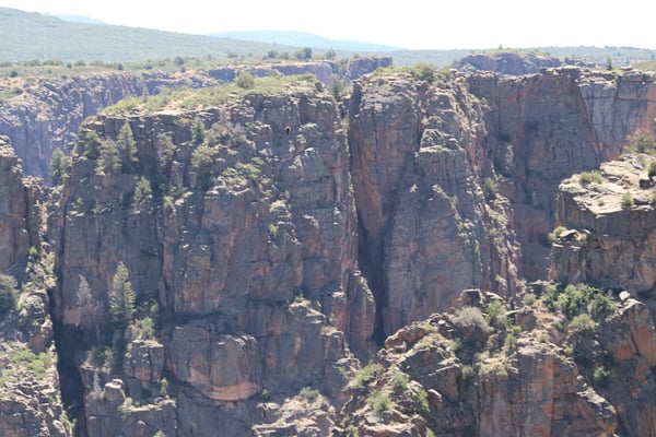 Towering columnar basalt cliffs and deep canyon gorge viewed from Chasm View overlook in Colorado. — Chasm View, Black Canyon of the Gunnison
