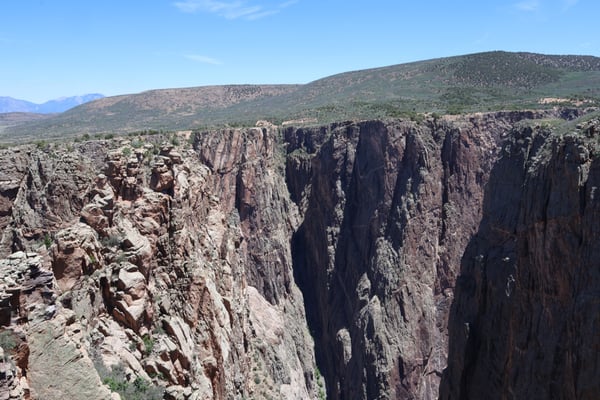 Dramatic columnar basalt cliffs at Rock Point near Montrose, Colorado, displaying distinctive vertical rock formations… — Rock Point, Black Canyon of the Gunnison