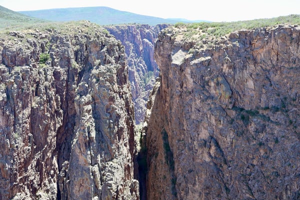 Deep narrow canyon with towering columnar rock formations at Rock Point, Montrose, Colorado. — Rock Point, Black Canyon of the Gunnison