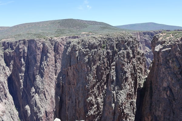 Dramatic columnar basalt formations at Rock Point, featuring tall hexagonal pillars carved by erosion, viewed from an… — Rock Point, Black Canyon of the Gunnison
