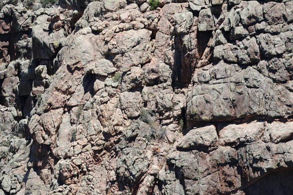 Fractured granite rock face at Rock Point near Montrose, Colorado, showing columnar jointing and lichen growth. — Rock Point, Black Canyon of the Gunnison