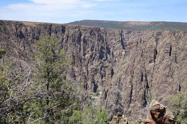 Dramatic columnar basalt formations and a river canyon viewed from Gunnison Point, a scenic overlook in the Black… — Gunnison Point, Black Canyon of the Gunnison