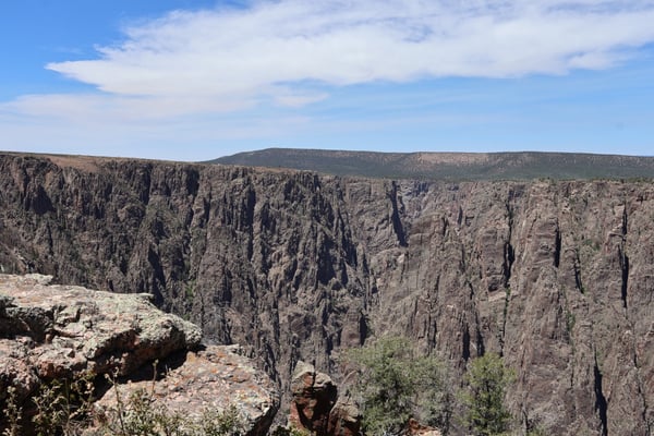 Dramatic columnar basalt formations and layered canyon walls viewed from Gunnison Point overlooking the Black Canyon of… — Gunnison Point, Black Canyon of the Gunnison
