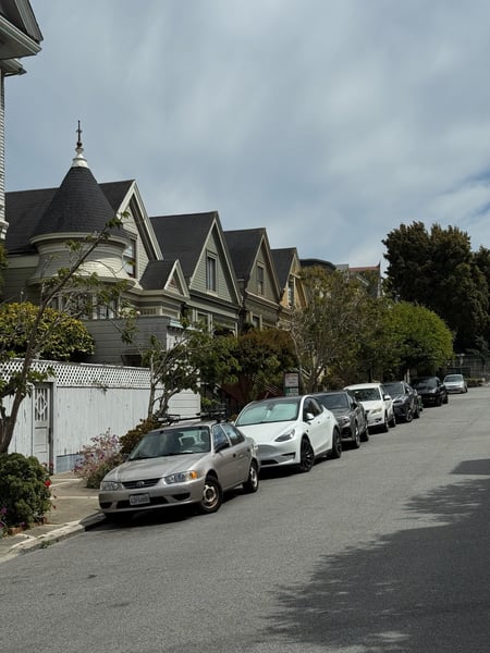 Victorian houses with distinctive peaked roofs line a residential street in San Francisco's Duboce Triangle… — Western Addition, San Francisco