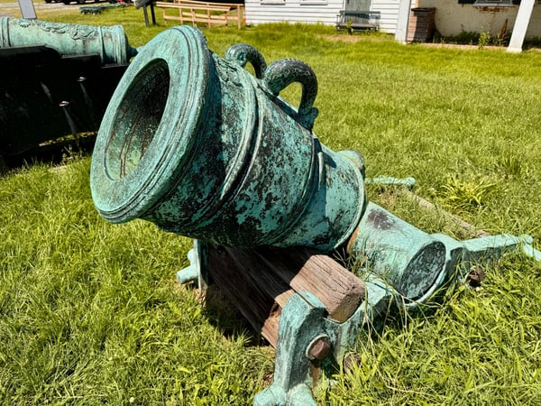 Weathered copper cauldrons with verdigris patina displayed on grass at a rural historical site. — Southwest Philadelphia, Philadelphia