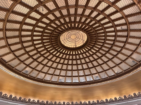 Ornate domed ceiling with geometric lattice pattern and central oculus, viewed from directly below. — Center City, Philadelphia