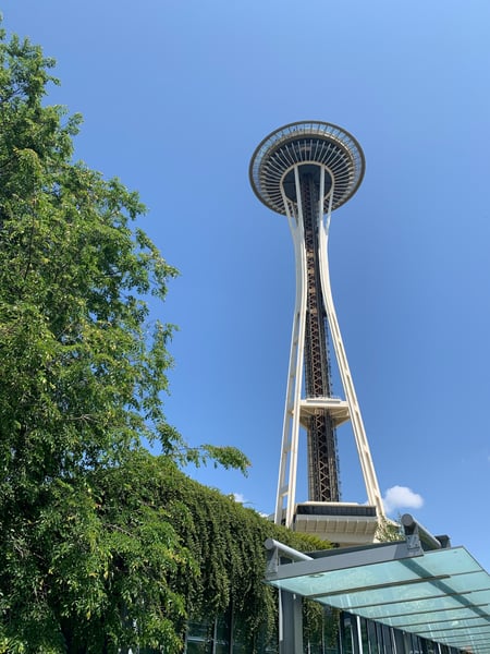 Space Needle observation tower photographed from ground level against clear blue sky in Seattle. — Belltown, Seattle