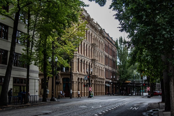 Historic Romanesque Revival buildings line a tree-shaded pedestrian street in downtown Portland, Oregon. — Old Town, Portland