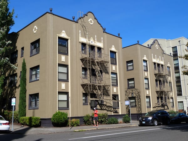 Art Deco apartment building with ornamental details and fire escapes, photographed from street level in Portland… — Northwest District, Portland