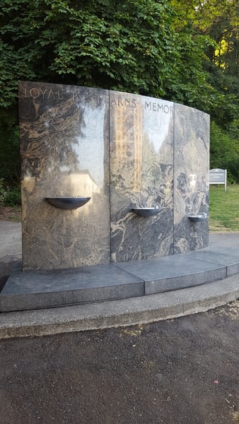 Loyal B. Stearns Memorial monument with three stone panels and water basins in a park setting surrounded by trees. — Goose Hollow, Portland