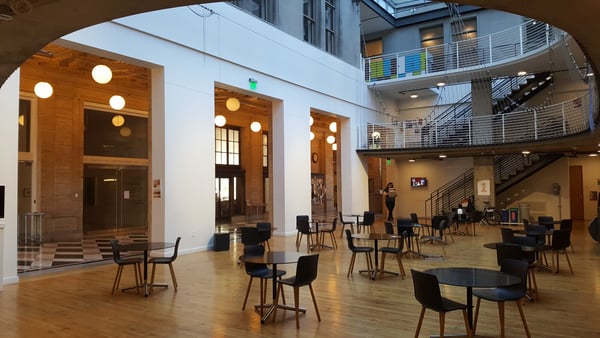 Modern art gallery interior with soaring ceilings, wooden architectural elements, and contemporary seating at PNCA. — Pearl District, Portland