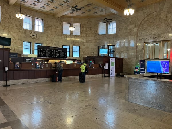 Interior of Portland Union Station ticket hall with marble walls, ornate ceiling, and service counters. — Pearl District, Portland