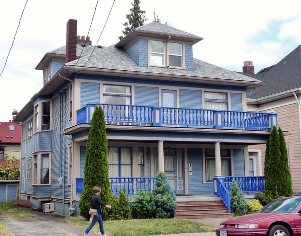 Sidney Raxworthy House, a blue Victorian-era residence with distinctive blue railings and a cupola, photographed from… — Northwest District, Portland