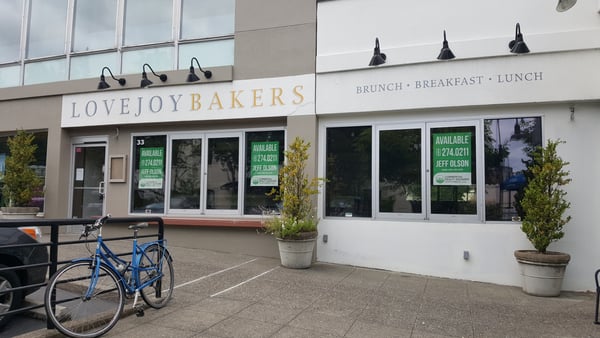 Lovejoy Bakers storefront with brunch, breakfast, and lunch signage in an urban commercial district. — Goose Hollow, Portland
